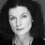 Photograph Of Margaret Ryckebusch - A Headshot Of A Woman With Shoulder Length Black Hair, Light Makeup, And A Pearl Necklace