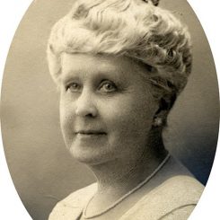 Photograph Of Florence W. Waite - A Headshot Of An Older Woman With Short Grey Hair, Wearing A Dress And Cardigan