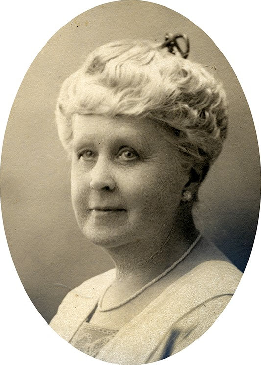 Photograph Of Florence W. Waite - A Headshot Of An Older Woman With Short Grey Hair, Wearing A Dress And Cardigan