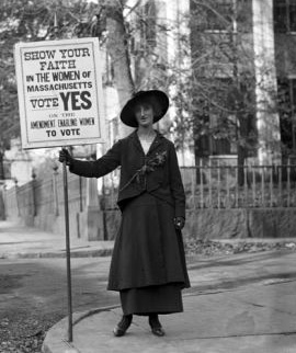 woman holding vote sign