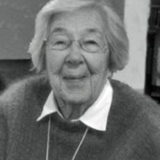 Photograph Of Ruth S. Atkinson - A Headshot Of An Older Woman With Short Grey Hair, Round Glasses, And A Sweater