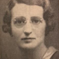Photo of Sylvia Finger - a headshot of a woman with short brown hair and round glasses