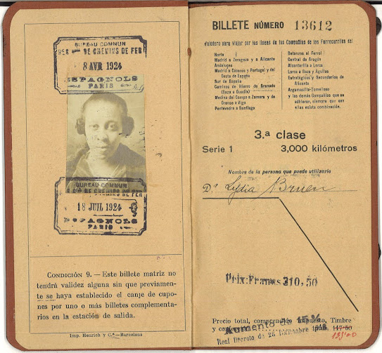 Travelling ticket/passport type document with an identifying photo of Lydia Brown.
