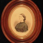 An Old Hand Tinted Albumen Photograph Of Elizabeth Marble. A Portrait Of A Woman With Her Hair Up; She Is Wearig A Conservative Black Garment