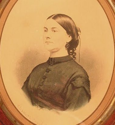 An Old Hand Tinted Albumen Photograph Of Elizabeth Marble. A Portrait Of A Woman With Her Hair Up; She Is Wearig A Conservative Black Garment