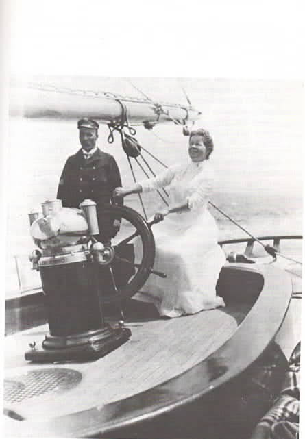 Photograph of Mary Parker Converse at helm of Calypso